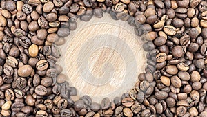 Roasted coffee beans can be used as a background. Top view of aromatic brown coffee beans scattered on the surface. Copy