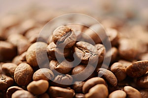 Roasted coffee beans close up. Espresso dark, aroma, black caffeine drink.