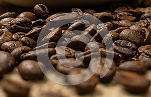 Roasted coffee beans.Coffee beans scattered on the table.