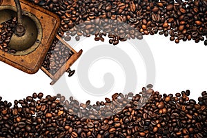 Roasted Coffee Beans and a Coffee Grinder Isolated on White Background