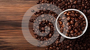 Roasted coffee beans on a dark wooden table and in a cup, top view