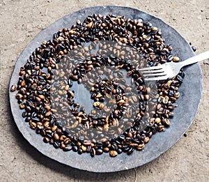 Roasted coffee beans in Ethiopia, Coffea arabica photo