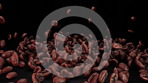 Roasted coffee beans fall on black background. Coffee to go.