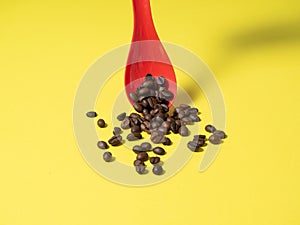 Roasted coffee beans falling down