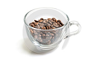 Roasted coffee beans in a glass cup