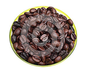 Roasted coffee beans in green circular container