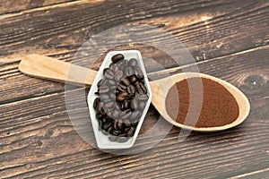 Roasted coffee beans, ground coffee, Cup of coffee, Wooden spoon with roasted coffee