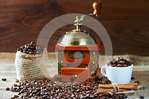 Roasted coffee beans and ground in a coffee grinder wooden