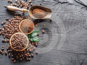 Roasted coffee beans and ground coffee on wooden table. Top view