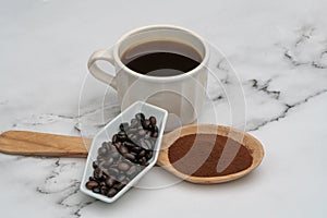 Roasted coffee beans, ground coffee, Cup of coffee, Wooden spoon with roasted coffee