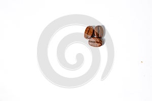 Roasted coffee beans isolated on a white background.