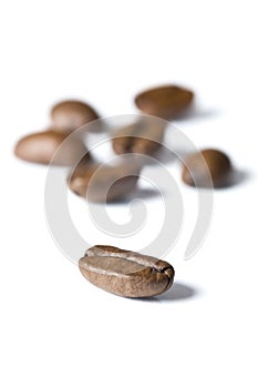 Roasted coffee beans isolated on white background - detail.