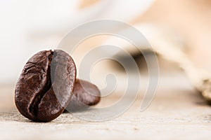 Roasted coffee beans on light background with copyspace