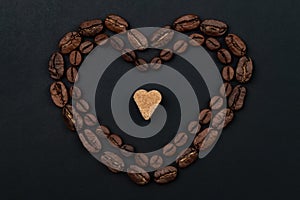 Roasted coffee beans placed in a shape of heart