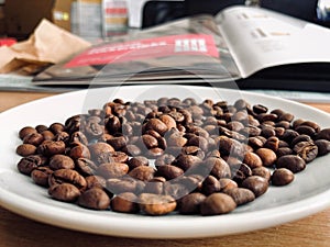 Roasted coffee beans on a plate