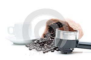 Roasted coffee beans in sack of cloth on a white background
