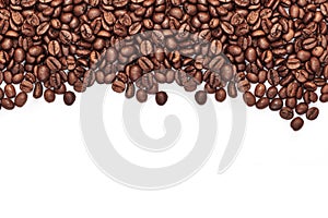 Roasted coffee beans with space for text on white table background