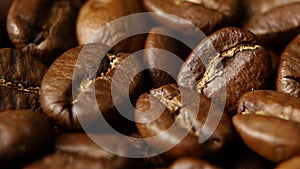 Roasted coffee beans on a table. Rotating. Close up