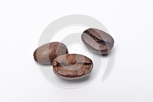 Roasted coffee beans on white background