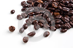 Roasted coffee beans on white background