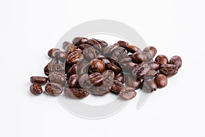 Roasted coffee beans on white background