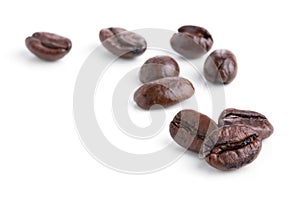 Roasted coffee beans on white background