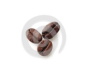 Roasted coffee beans on white background