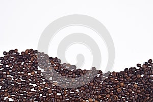 Roasted coffee beans on white background