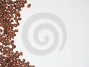 Roasted coffee beans on white background