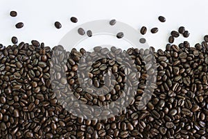 Roasted coffee beans on white background.Creative background concept