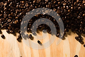 Roasted coffee beans on wood