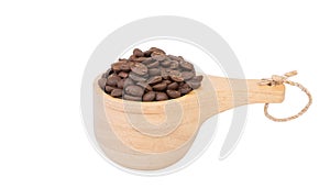 Roasted coffee beans in wood bowl isolated on white background