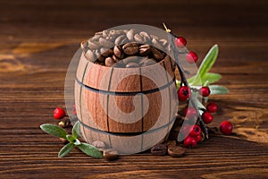 Roasted coffee beans in a wooden barrel