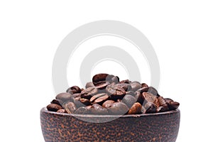 Roasted coffee beans in wooden bowl isolated on white background