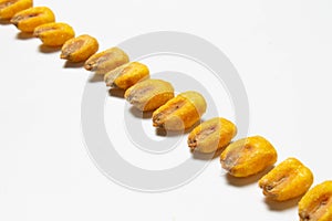 Roasted corn nuts on white background
