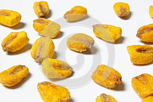 Roasted corn nuts on white background