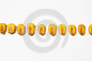 Roasted corn nuts on white background