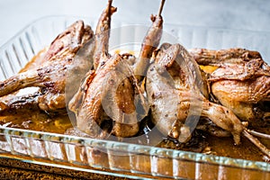 Roasted Crispy Quail Meat in Glass Bowl / Fried Small Chickens.