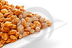 Roasted Crunchy Peanuts in a white ceramic square plate, made with peanuts.