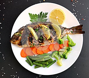 Roasted dorada fish with vegetables