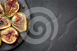 Roasted Figs with Honey and Rosemary Top View on Slate