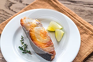 Roasted fish steak with lemon