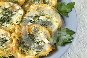 Roasted fried slices zucchini in egg batter