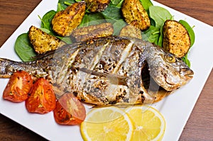 Roasted gilthead fish photo