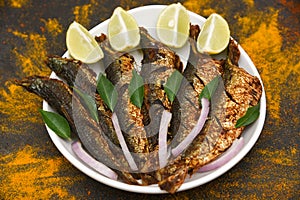 Roasted grilled baked or deep fried sardine fish Kerala India