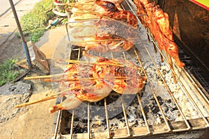 Roasted grilled chicken are being ripen as the color of cooked rice, chicken skin is food on the stove.