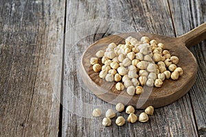 Roasted hazelnut. Hazelnuts on wood background