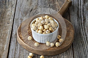 Roasted hazelnut. Hazelnuts on wood background