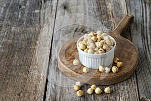 Roasted hazelnut. Hazelnuts on wood background