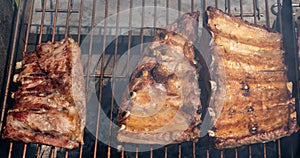 Roasted Juicy spare ribs cooked over the coals on a barbecue. Summer and holiday time